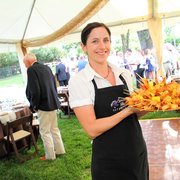 Anna butler serving shrimp skewers