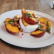 Panna cotta with fresh local peaches and basil.