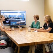 Conference room with whiteboard, smart TV. Seats up to 12. Can be reserved by non-members