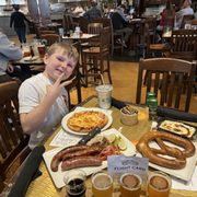 Kids Cheese Pizza, The Big Pretzel, Sausage Platter, flight of beer