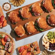 a platter of sandwiches and fruit