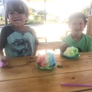 two kids sitting at a table
