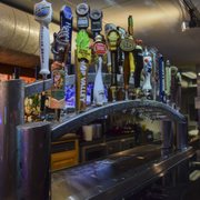 a row of beer taps