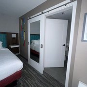 Barn door separates the bathroom.