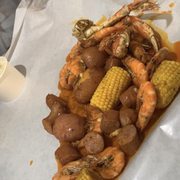 One bag with a pound of shrimp, some corn, sausage, and potatoes, and 1/2 pound of crab legs. The second bag was similar with no spice.