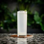 a glass of white cocktail