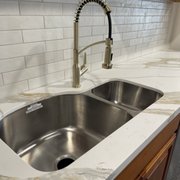 Stainless steel double sink 70/30 with a Karran Scottsdale brushed gold faucet.