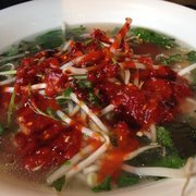 regular/large #6 beef rice noodle soup with added yellow onions and all the spicy goodness. he likes it spicy.