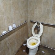 a dirty toilet in a public restroom