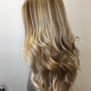 Total transformation on Christmas Eve. We balayaged this lovely woman's hair with several natural shades to create a natural look.
