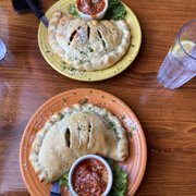 Margherita Pizza & Sausage and Peppers Pizza made into calzones