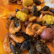 Shrimp, mussels, potatoes, and corn.