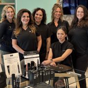 Our aesthetics team and some fantastic Revision Skin Care products.