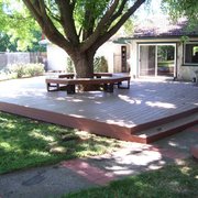 a patio with a table and chairs