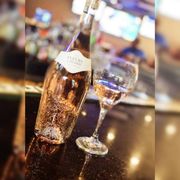a bottle of wine and a glass of wine