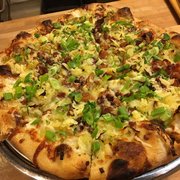 Mashed potato pizza with bacon, scallions, leeks, white cheddar and Yukon gold potatoes