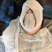 The hot towel was super relaxing for him. It's okay for men to get pampered too!