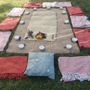 Set up for corporate wellness event. Sound meditation for stress reduction.