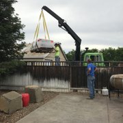 Our crane truck in action delivering a new fireplace to it's happy new owners!