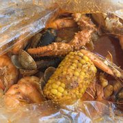 cooked crab legs and corn