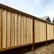 a wooden fence in a yard