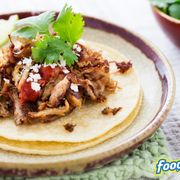 a taco with meat and vegetables