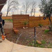 a man using a chainsaw