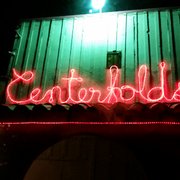 a neon sign lit up at night