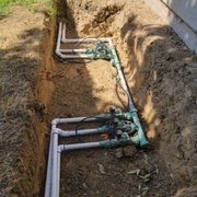 New irrigation manifold with an open slot to add a garden zone later.