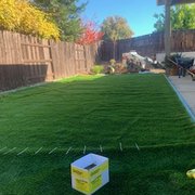 a backyard with artificial grass