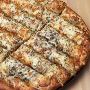 It's infamous! Bakery fresh bread, seasoned with garlic and herbs. Add cheese for extra deliciousness! Served with ranch or zesty red sauce