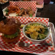 The spicy burger and side salad. With some delicious wings in the background
