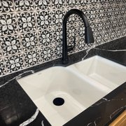 Executive chef double Cast iron sink by Kohler, offered in all Kohler colors. Kentland faucet in black.