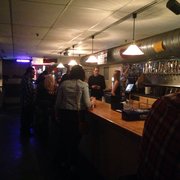 a group of people at the bar