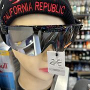 a mannequin wearing a hat and sunglasses
