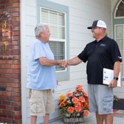 Jordan Boswell, General Manager doing a final inspection of the completed roofing project.