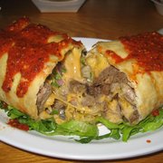 Tri Tip Chimichanga (without beans and rice. had lots of cheese and cilantro inside and their hot sauce covering the top)