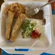 Taquitos with refried beans and rice. There are usually 3, but my son ate one already. Delish. Will definitely be back.
