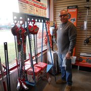 Owner Doug Gillis works on the American Power Pull display in the store.