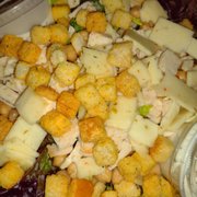Salad with Spring Greens, Romaine lettuce, cherry tomatoes, croutons, Garbanzo beans, Pepper Jack cheese and vegan Ranch in the side.
