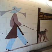 Cute mural along alleyway to back.