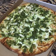 16" with pesto sauce with chicken and chopped garlic on top. This is my favorite spot for pizza in Chico just make sure to call ahead