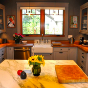 a kitchen with marble countertops