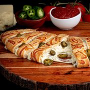 a piece of pizza with olives and cheese