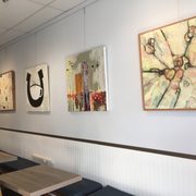 a row of tables in a coffee shop