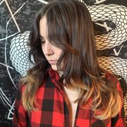 Wolf layered cut Curtain bangs and blow out.