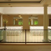 rows of white chairs and tables