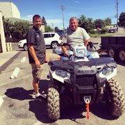 Goin over the new ATV before loading up!