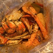 cooked crab legs in a plastic bag