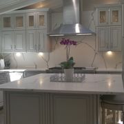 The marble counter tops can be found throughout the kitchen, and even on the back wall for added cohesiveness.